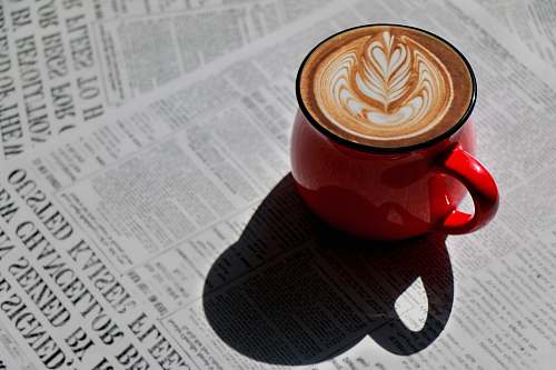 cup red ceramic mug with heart shaped coffee beverage